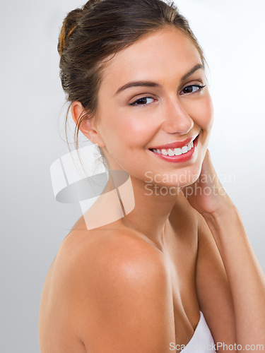 Image of Woman, face and skincare with dermatology for beauty, smile with shine and antiaging on white background. Happy in portrait, cosmetic care and healthy skin glow with headshot and makeup in studio