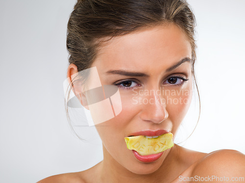 Image of Woman, portrait and apple for eating in studio with wellness detox, healthy eating and nutrition diet. Model, person and fruit for organic cosmetics, natural beauty and skincare on white background