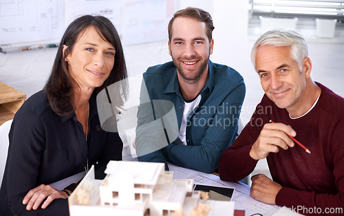 Image of Employees, portrait and model for industrial architecture, presentation and project layout for construction. Property developers or engineers with 3d graphic or design and remodeling from blueprint.