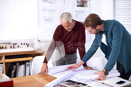 Image of Coworker, men and blueprint with design at office with pencil for drawing a building renovation, construction and project as architects. Business, people and teamwork on task, draft and layout