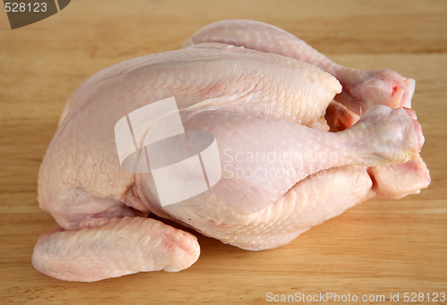 Image of Raw chicken on a chopping board