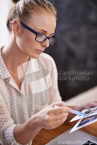 Image of Reading, magazine and woman in office to check review of professional media or research news in print business. Paperwork, notes and editor with article of information or analysis of photography