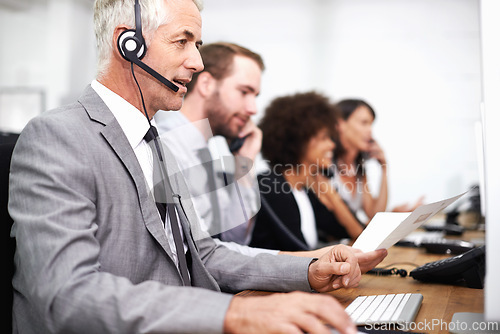 Image of Call center, career and man in office with headset working on online telemarketing consultation. Happy, customer support and professional male consultant with crm service communication in workplace.