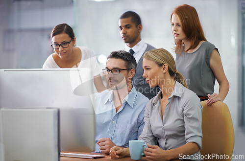 Image of Group, collaboration and help on computer from team, mentor and training employees in office. People, reading and learning from businessman in company coaching in IT, software or feedback on project