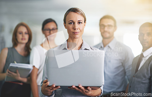 Image of Portrait, team leader and business woman with laptop in office, workplace or company together. Face, computer and professional group of employees, entrepreneur and consultants with collaboration