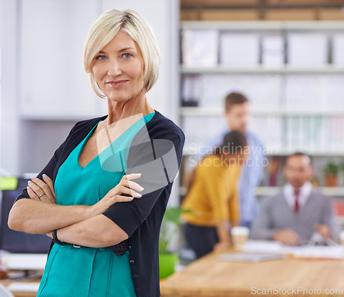 Image of Businesswoman, arms crossed and portrait in office or workplace for presentation or meeting with confidence. Mature person, entrepreneur and corporate at work professional or formal in boardroom