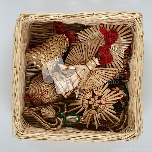 Image of traditional Christmas straw decorations in a wicker box