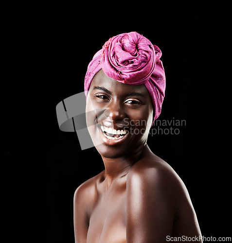 Image of Black woman, head wrap and beauty portrait with laugh, skincare and natural cosmetics in studio. Traditional, turban and African fashion with wellness and skin glow with makeup and dark background