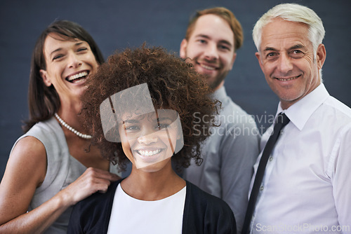 Image of Portrait, team and happy business people in studio isolated on a blue background. Face, smile and group of diverse professional consultants laughing for collaboration, cooperation or working together