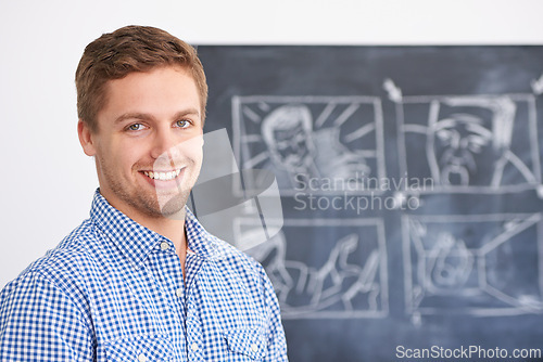 Image of Teacher, portrait and man in school with blackboard, drawing and education in classroom. Montessori, academy and person teaching with chalkboard on creative campus for development in visual learning