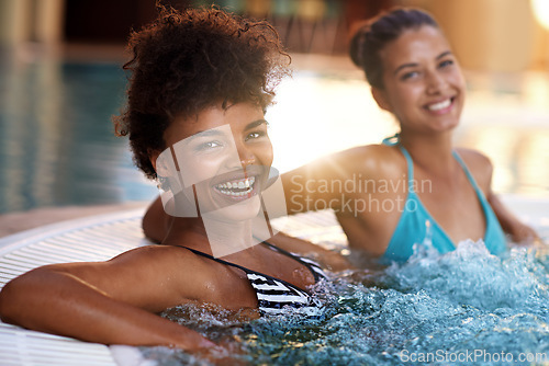 Image of Women, friends and smile in portrait in jacuzzi to relax, self care and pamper day at spa for wellness and healing. Water, bubbles and hot tub for detox and stress relief, friendship date and bonding