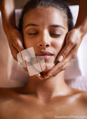 Image of Woman, spa and massage on face with hands and care for facial, wellness and beauty treatment on bed. Above, towel and calm african female woman with skincare and relax at a hotel with skin glow