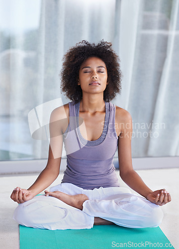 Image of Woman, lotus and meditate in yoga to relax, peace and mental health with wellness or mindfulness at home. Young African person with eyes closed thinking of spiritual, holistic and breathing exercise