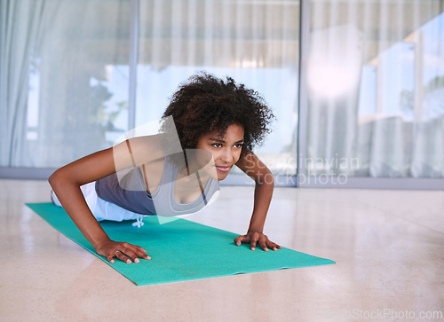 Image of Woman, fitness and push up for training, exercise and wellness with muscle health on floor at home or outdoor. Young and african person with shoulder or arm workout, planking or pilates for strength