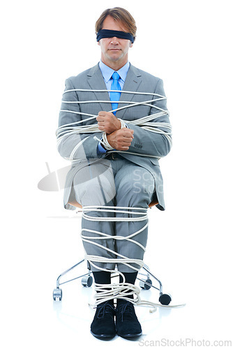 Image of Businessman, tied up and hostage with chair in kidnapped, robbery or silence on a white studio background. Man or employee with ropes or handcuffs in crime, theft or business corruption on mockup