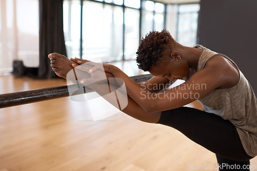 Image of Ballet, dancer and black woman stretching for balance, wellness and theatre performance in studio. Creative dance, fitness and person do ballerina movement for exercise, training and art practice