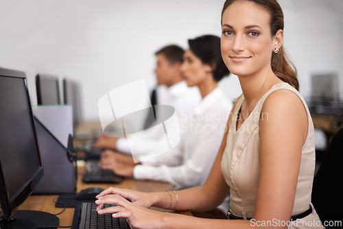Image of Business woman, portrait and computer with team in call center for email, support or online service at office. Female person, agent or employee with smile on desktop PC with group or agency for help