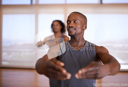 Image of Gym, dance and man teaching people in studio for fitness, sport and exercise for balance with performance. Lesson, coach and male person training student in class, active and wellness with health