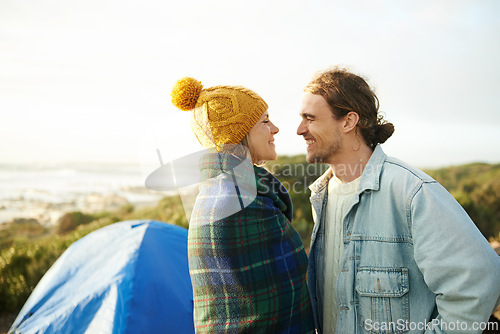 Image of Happy couple, camping and bonding together in outdoor, blanket and romantic getaway to relax by tent. Man, woman and love on vacation for honeymoon break, adventure and travel for marriage in nature