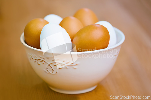 Image of Agriculture, protein and eggs in bowl for sustainable, organic food and reproduction with wellness. Diet, closeup and produce from livestock for nutrition, breakfast or healthy meal on table