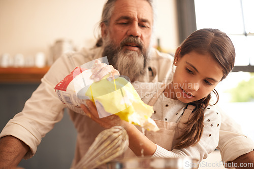 Image of Girl, child and grandfather with flour in kitchen for cooking, baking and teaching with support or helping. Family, senior man and grandchild with dough preparation in home for bonding and learning