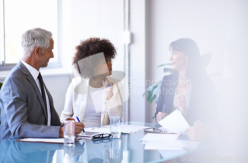 Image of Corporate, people and discussion in conference room for strategy or collaboration for planning, partnership and conversation. Boardroom, business employees and reports for b2b meeting for company.