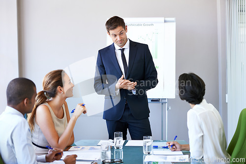 Image of Meeting, presentation and businessman in office with ideas, stats or speaker at b2b workshop. Teamwork, strategy and business people in conference room brainstorming discussion, planning and review