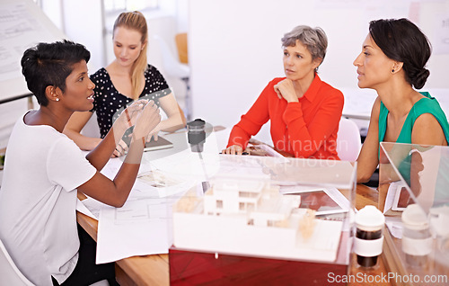 Image of Group of people, architect or business in meeting, teamwork or planning of creative brainstorm. Businesswomen, blueprint or model as corporate, diversity or collaboration in property development