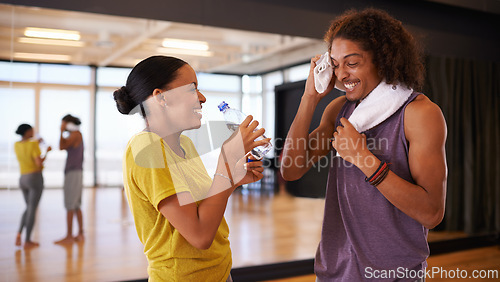 Image of People, drinking water and break in dance studio, smile and relax from practice or learning routine. Partners, happy and laugh for humor in training, hydration and nutrition for exercise or workout