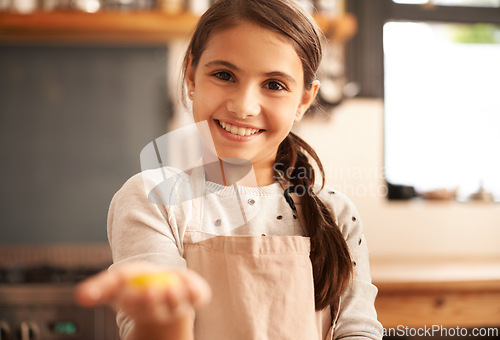 Image of Girl, portrait and dough in hand for baking, pastry and prepare flour mixture in kitchen. Female person, kid and smile for learning in home, child development and education for cookie skill or cake