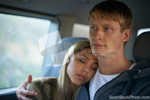 Image of Car, love and couple hug in a taxi for travel, journey or bonding on road trip together. Cab, commute or people embrace on backseat with support, safety or care while sleeping in chauffeur transport