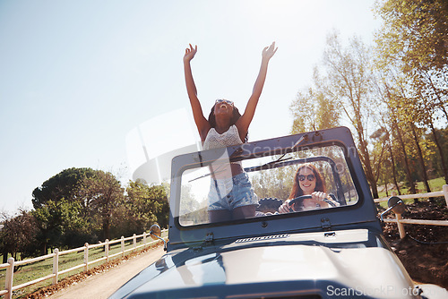 Image of Happy women, excited and travel on road trip in countryside and bonding together for adventure in nature. Friends, driving and journey in convertible suv on holiday and outdoor in summer in texas