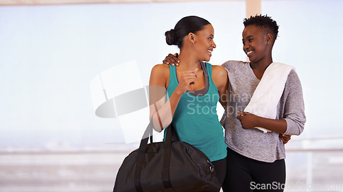 Image of Fitness, hug and happy friends at gym walking after training, exercise or sports routine. Workout, club and women smile with support after morning cardio, challenge or bonding with conversation