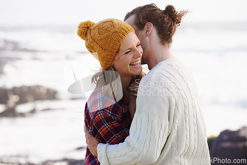 Image of Hug, beach and couple with love, date and happiness with weekend break, humor and vacation for honeymoon. Outdoor, romance or embrace with woman or man with sunshine or marriage with holiday or funny