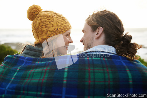 Image of Happy couple, relax and bonding together in nature, blanket and romantic getaway with camping in forest. Man, woman and love on vacation on weekend break, countryside and travel in woods for sunset