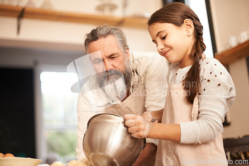 Image of Girl, child and grandfather with baking in kitchen for cooking, mixing and teaching with support and helping. Family, senior man and grandchild with dough preparation in bowl for bonding and learning