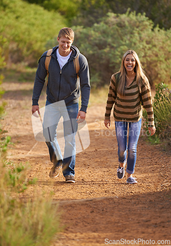 Image of Field, hiking and couple in nature, happy and bonding for holiday, vacation and trip to Amsterdam. Outdoor, man and woman together for love for anniversary of girl and male person with backpack