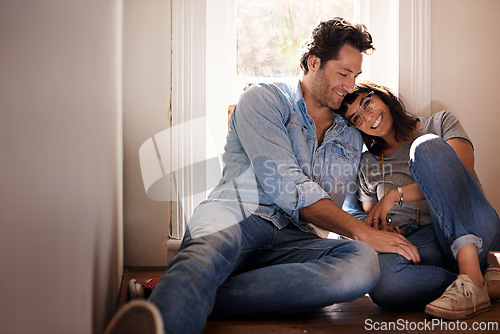 Image of Floor, relax or happy couple laughing in home living room in conversation and speaking together. Man, funny woman or romantic people in apartment or house talking with love, support or joke humor