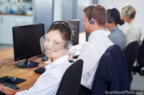 Image of Help desk, phone call and row with portrait of happy woman at customer support office with headset. Smile, telecom and client service agent at callcenter for online consultation, team and computer