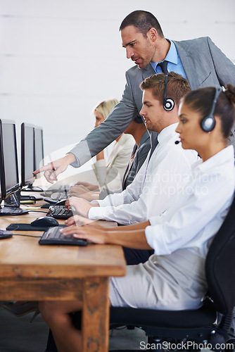 Image of Help desk, management and row of women, men and typing on computer at customer support. Headset, telemarketing and client service agent at callcenter for online consultation, team or checking quality