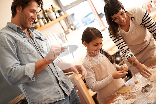 Image of Mother, father and girl with baking dough in kitchen with flour, happiness and teaching with support. Family, parents and child with helping, learning and bonding with cooking for hobby and snack