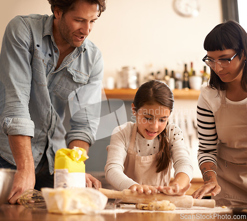 Image of Mother, father and girl with dough for cooking in kitchen with rolling pin, happy and teaching with support. Family, parents and child with helping, learning and bonding with flour for cake and snack