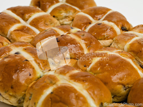 Image of Hot cross, buns and easter or food vacation for traditional brunch or celebration baked goods, pastry or religion. Snack, meal and festive season fiber or nutrition dessert as treat, recipe or event