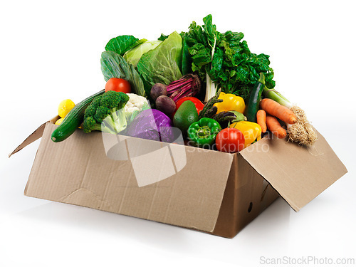 Image of Studio, box and fresh or organic vegetables for nutrition or wellbeing, ripe and raw ingredients for sustainability or eating. Agriculture, produce and healthy diet for vegan, wellness and protein.