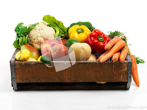 Image of Studio, crate and fresh or organic vegetables for nutrition or wellbeing, ripe and raw ingredients for sustainability or eating. Agriculture, produce and healthy diet for vegan, wellness and protein.