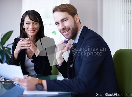 Image of Business people, teamwork and portrait in meeting with documents for financial review, data analytics and discussion. Collaboration, man and woman in boardroom with infographic feedback and happiness