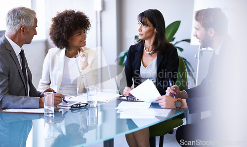 Image of Business, employees and discussion in conference room for strategy or collaboration for planning, partnership and conversation. Boardroom, corporate people and reports for b2b meeting for company.