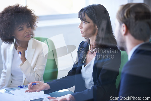 Image of Business people, teamwork and meeting with discussion in office for corporate planning, brainstorming and diversity. Professional, employees and collaboration in boardroom with lens flare or feedback