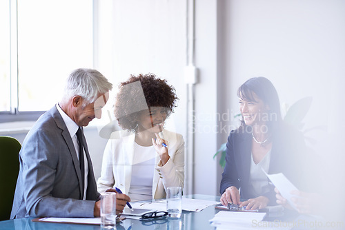 Image of Corporate, employees and discussion in conference room for strategy or collaboration for planning, partnership and conversation. Boardroom, business people and reports for b2b meeting for company.