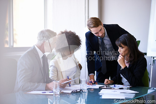 Image of Corporate, employees and meeting in conference room for strategy or collaboration for planning, partnership and conversation. Boardroom, business people and reports for b2b discussion for company.